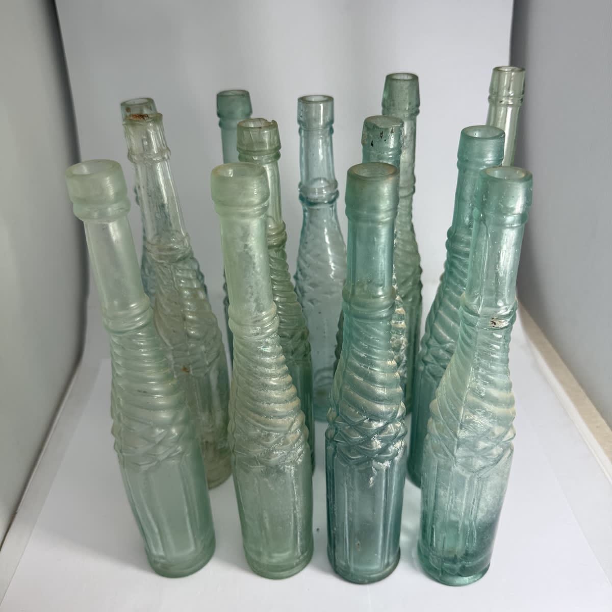 13 Half Whirly or Whirley type Salad Oils. Small sizes. One Shear top. Varying styles and colours.