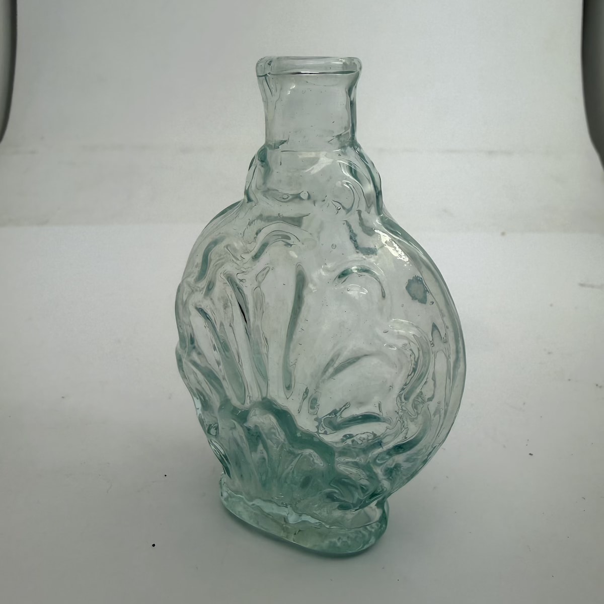 Goldfields Cologne. Shell type pattern with fancy label space. Crude tool finished lip. Tube pontil scar. Aqua. 2 oz.