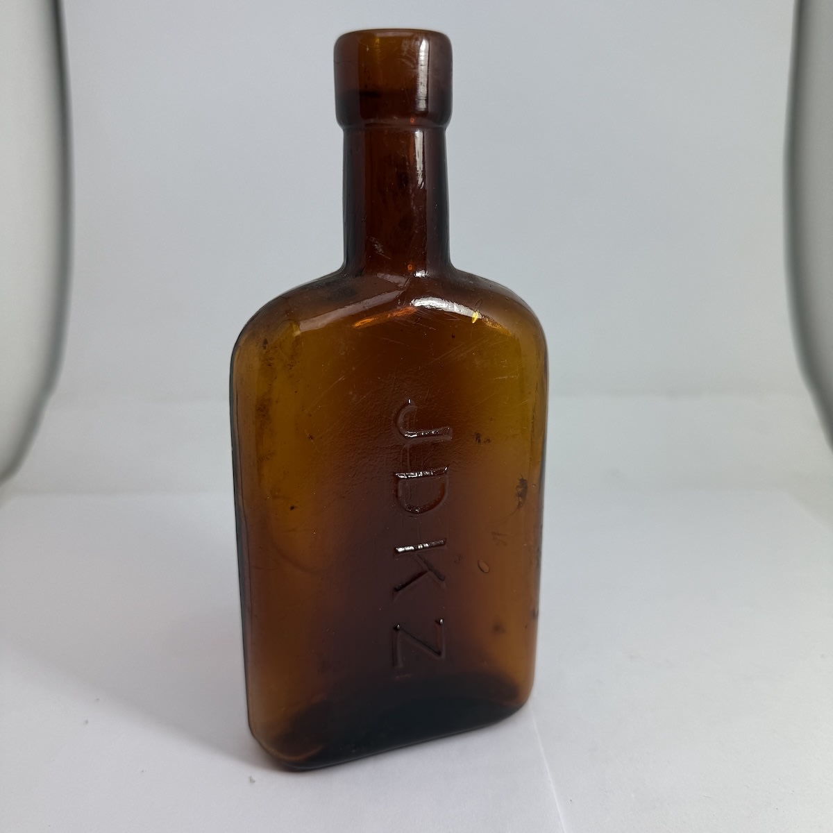 Gin Flask. JDKZ. AGM base mark. Amber. 5 oz. 160 mm.
