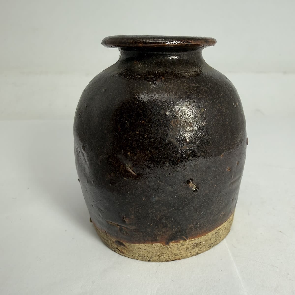 Little Chinese Jar. Flared lip. Brown Glaze. 67 mm tall.