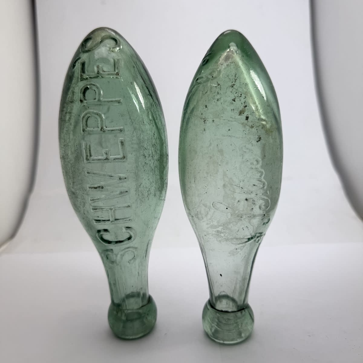 2 Small Torpedos: Schweppe's in bold lettering; J. Schweppe & Co Ltd in script.