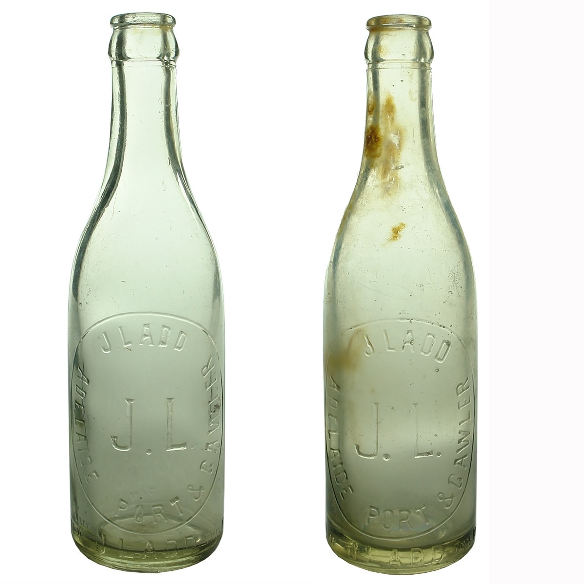 2 Crown Seals: Slightly different variations of J. Ladd, Adelaide, Port and Gawler. Gawler goes slightly higher in the embossing on one than the other with a bigger gap to the &. Clear. 10 oz. (South Australia)