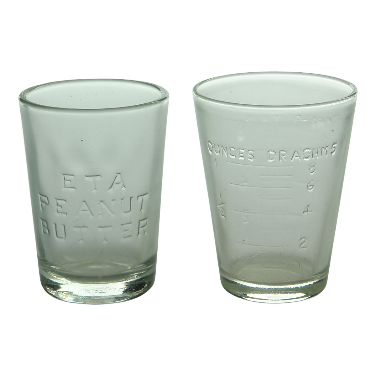 Glassware. 1. Eta Peanut Butter Jar. Embossed inner surface. 2. Graduated measuring glass in ounces, drachms, table and tea spoons.. Embossed inner surface.