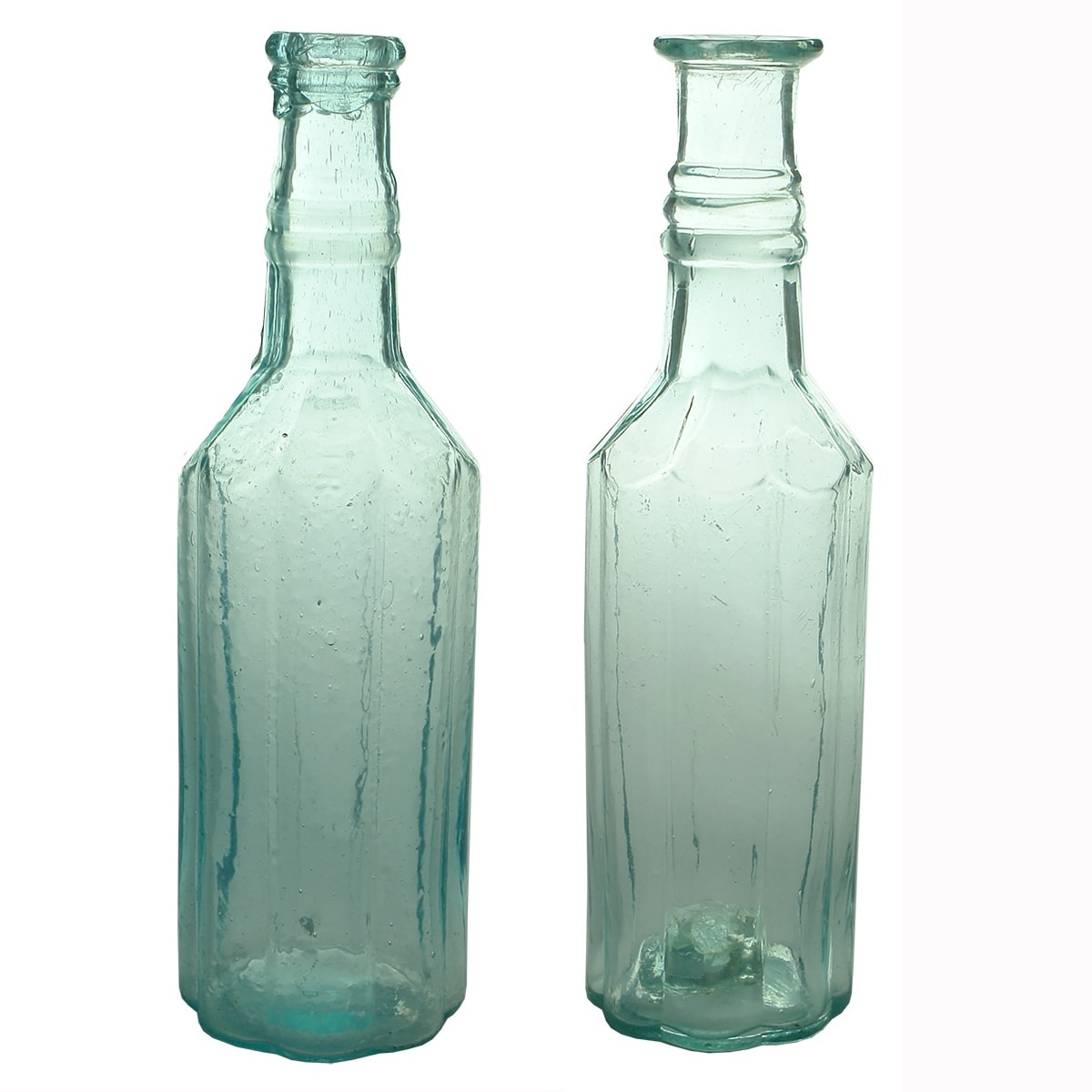 2 Goldfields Pepper Sauces: Large & Small. Large with Cross Hinge Mould, small with sharp tube pontil scar. American. Large has faint Wells Miller Provost on the shoulder.