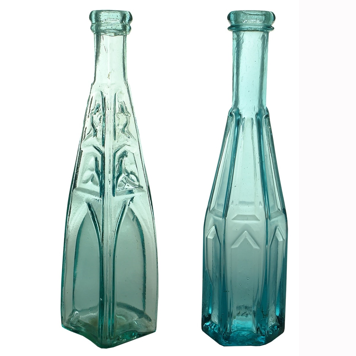 2 Goldfields era Pepper Sauces: Four sided Gothic type with decoration; Hexagonal Gothic type with plain panels. Pontil scar over hinge mould on the 4 sided one, plain base to the other.