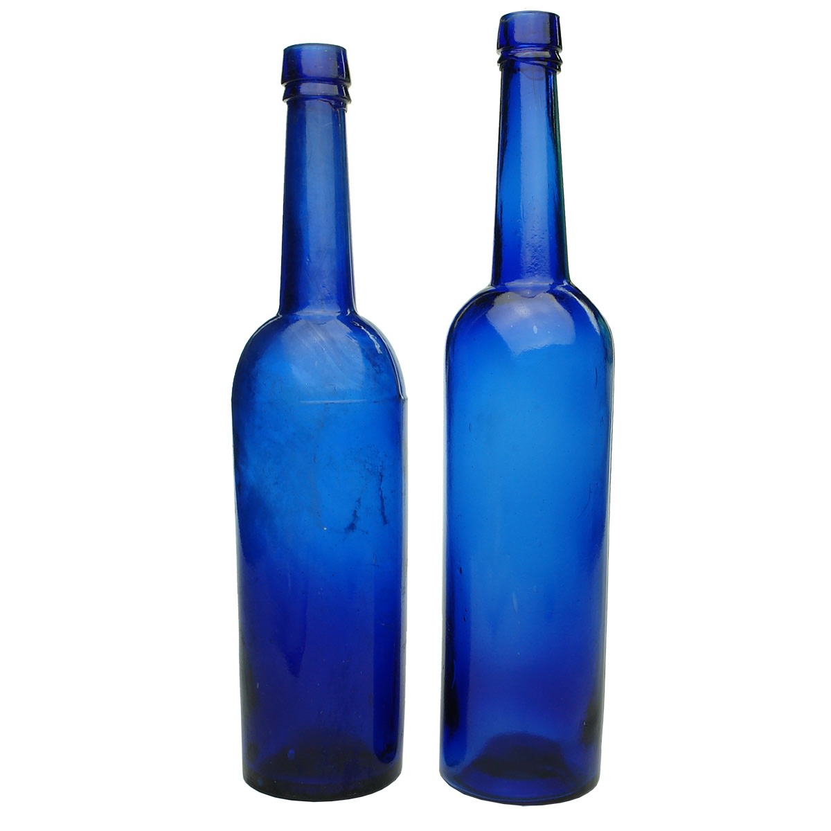 Household. Pair of 10 ounce cobalt castor oils.