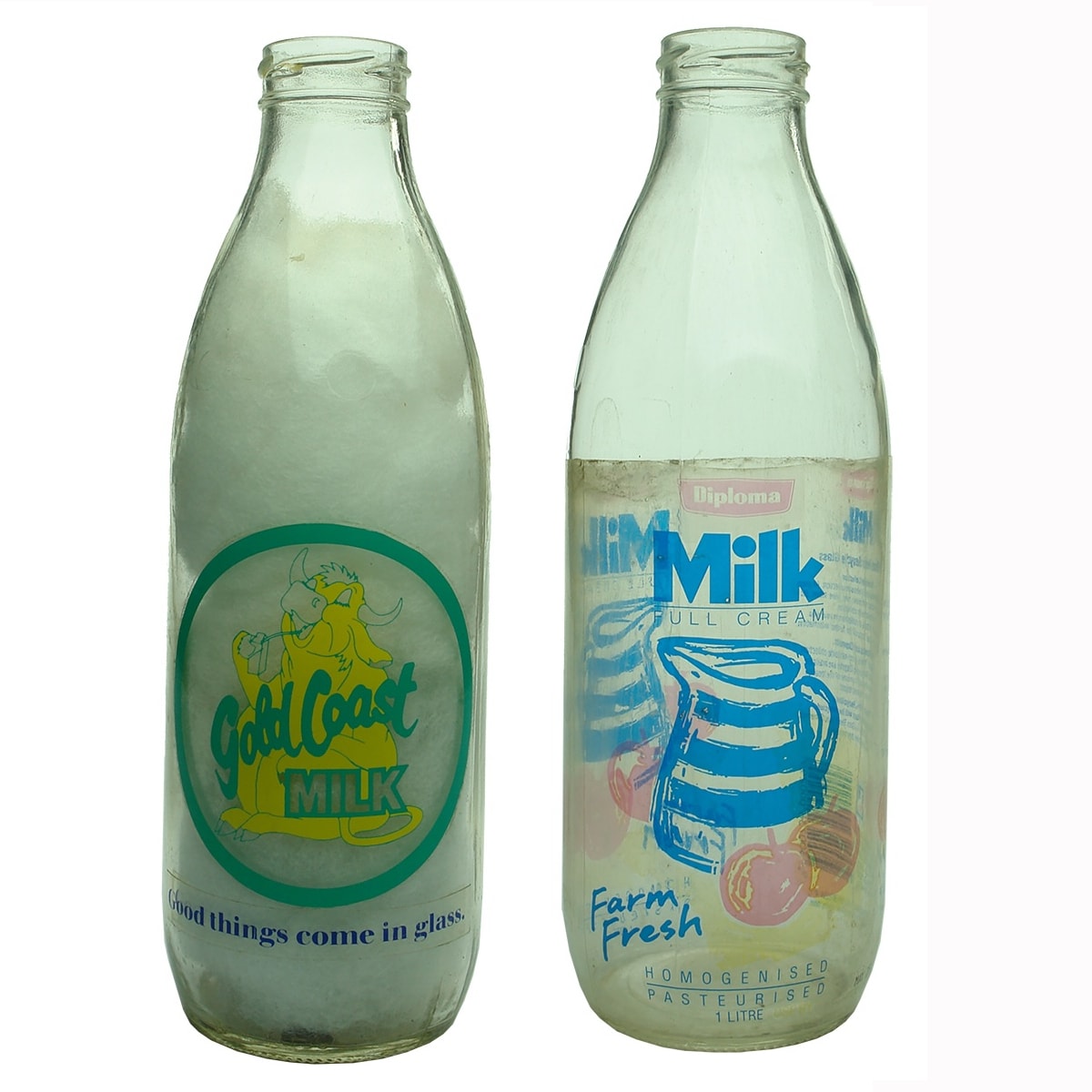 2 Milk Bottles with plastic wrap labels: Gold Coast Mlik; Diploma Milk Farm Fresh.