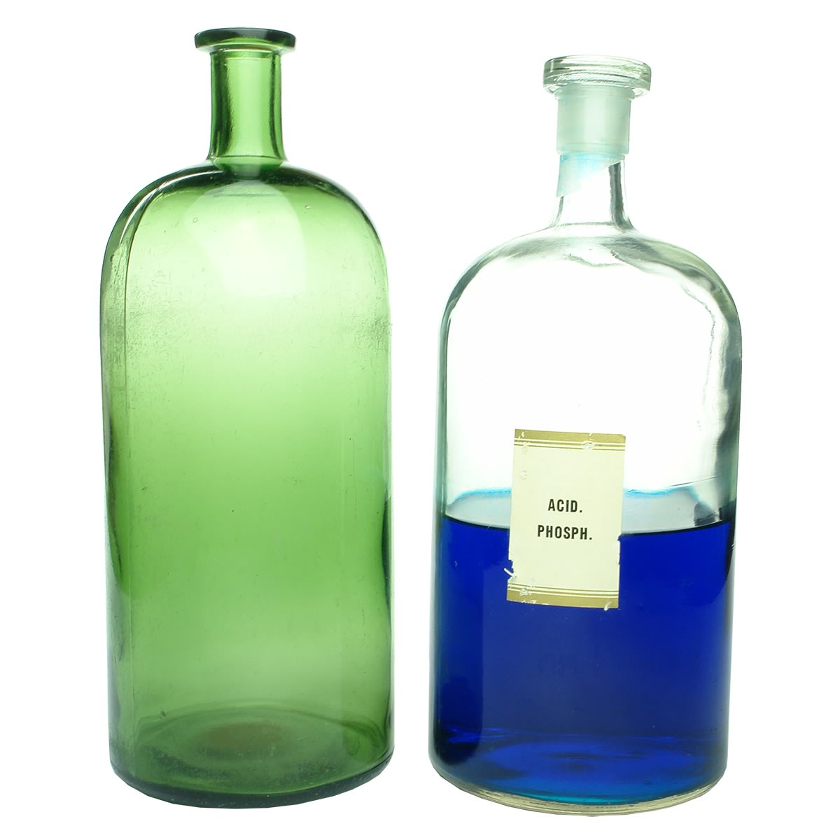 Pharmacy. Two bulk chemical jars: 1. Machine made, green. 308 mm. 2. Machine made, clear. 290 mm with half blue contents. (NOT FOR POST)