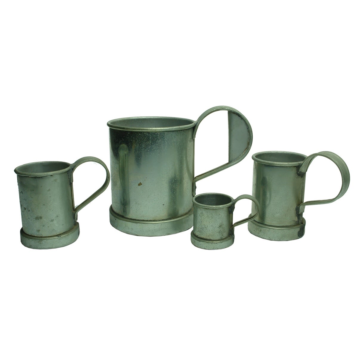 4 Stainless Steel measuring jugs: 1/2 Gill; 1 1/2 Gill; 1/2 Pint and Quart.