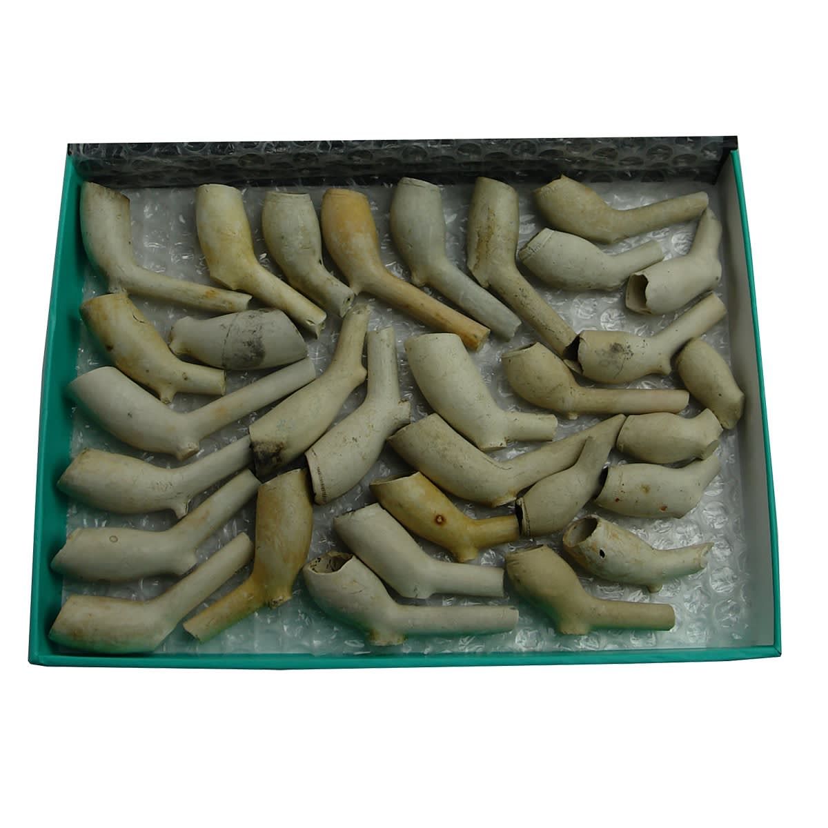 30 odd early clay pipe bowls. Dating from around 1580 up to 1800. Skinny round footed bowls. Would have had long stems.