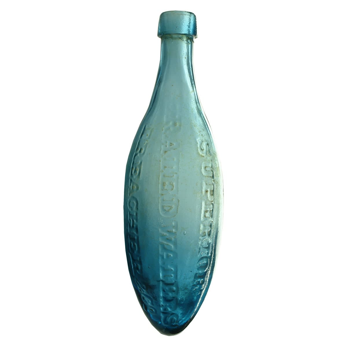 Torpedo. Treacher & Co Limited., Chemists, Bombay. Long pointy shape. Large square collar top. Mid Blue. (Mumbai, India)