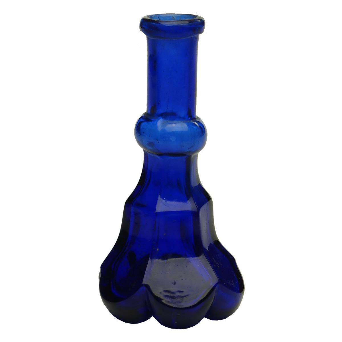 Fancy small bottle known as a Crosse & Blackwell Essence. Pontil type scar and roughness on the base. Cobalt Blue. 2 oz.
