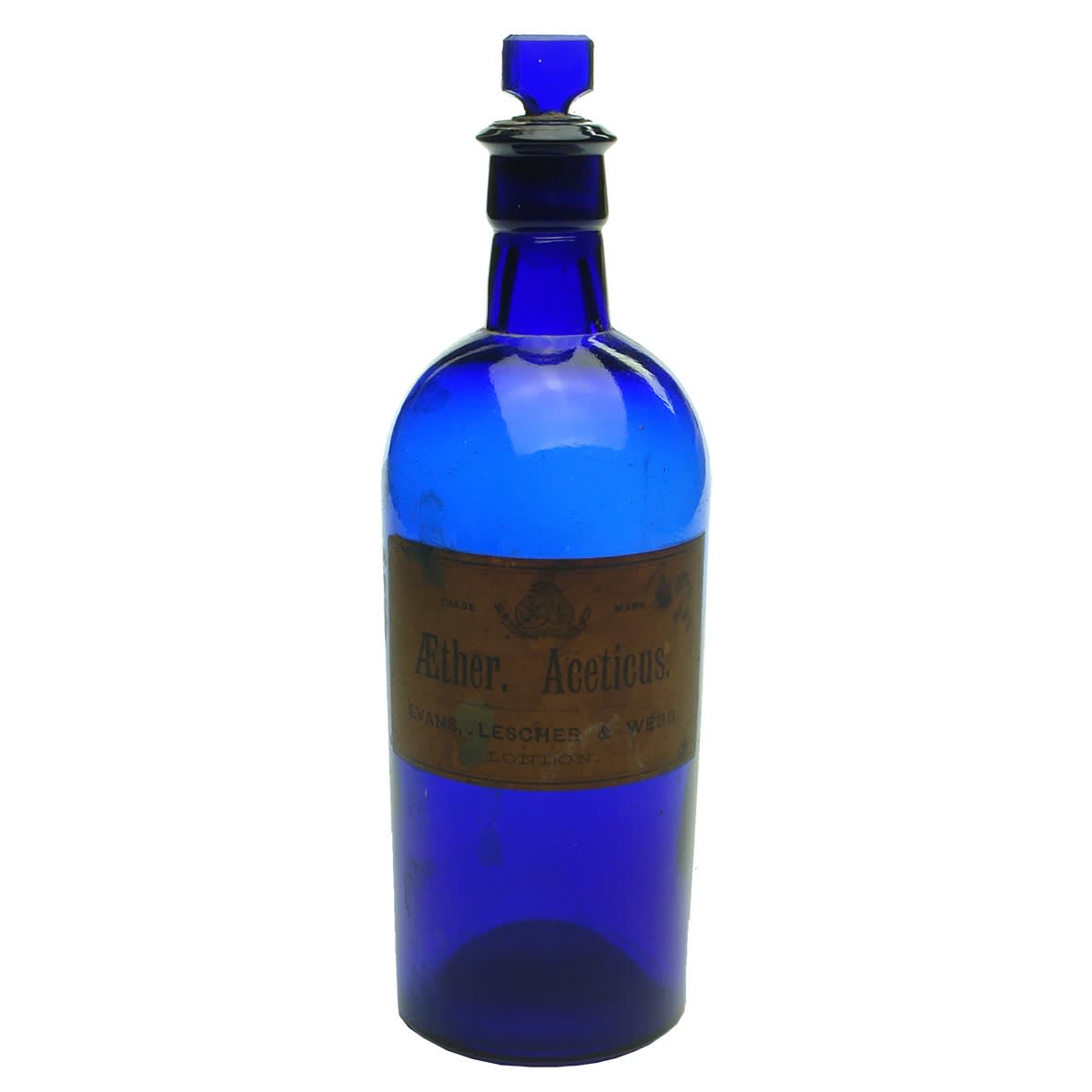 Blue Glass Chemist Bottle. Original Label: Evans, Lescher & Webb London. Original stopper stuck in place.