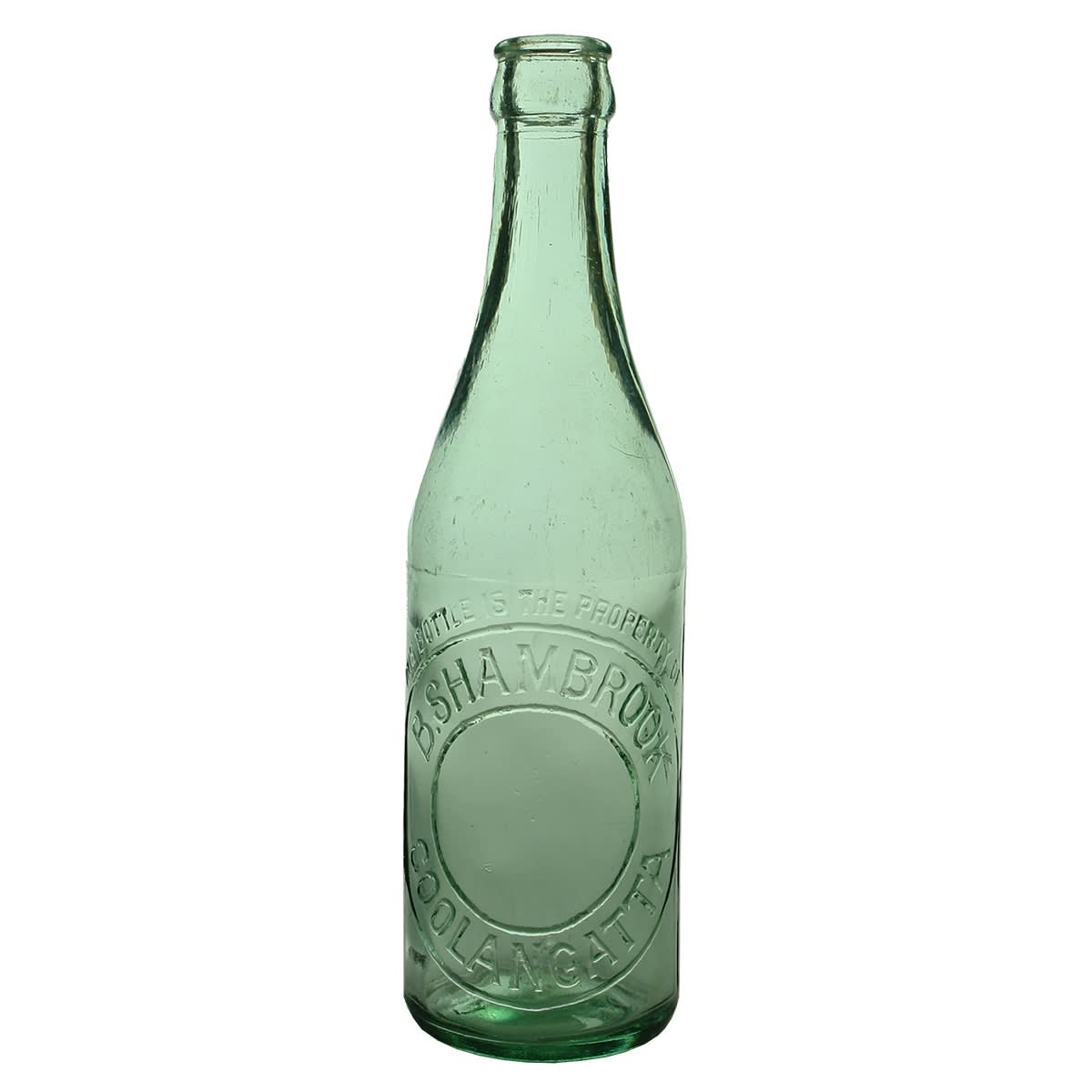 Crown Seal. B. Shambrook, Coolangatta. AGM B19 base mark. "This bottle..." embossing and larger embossing in circles. Aqua. 10 oz. (Queensland)