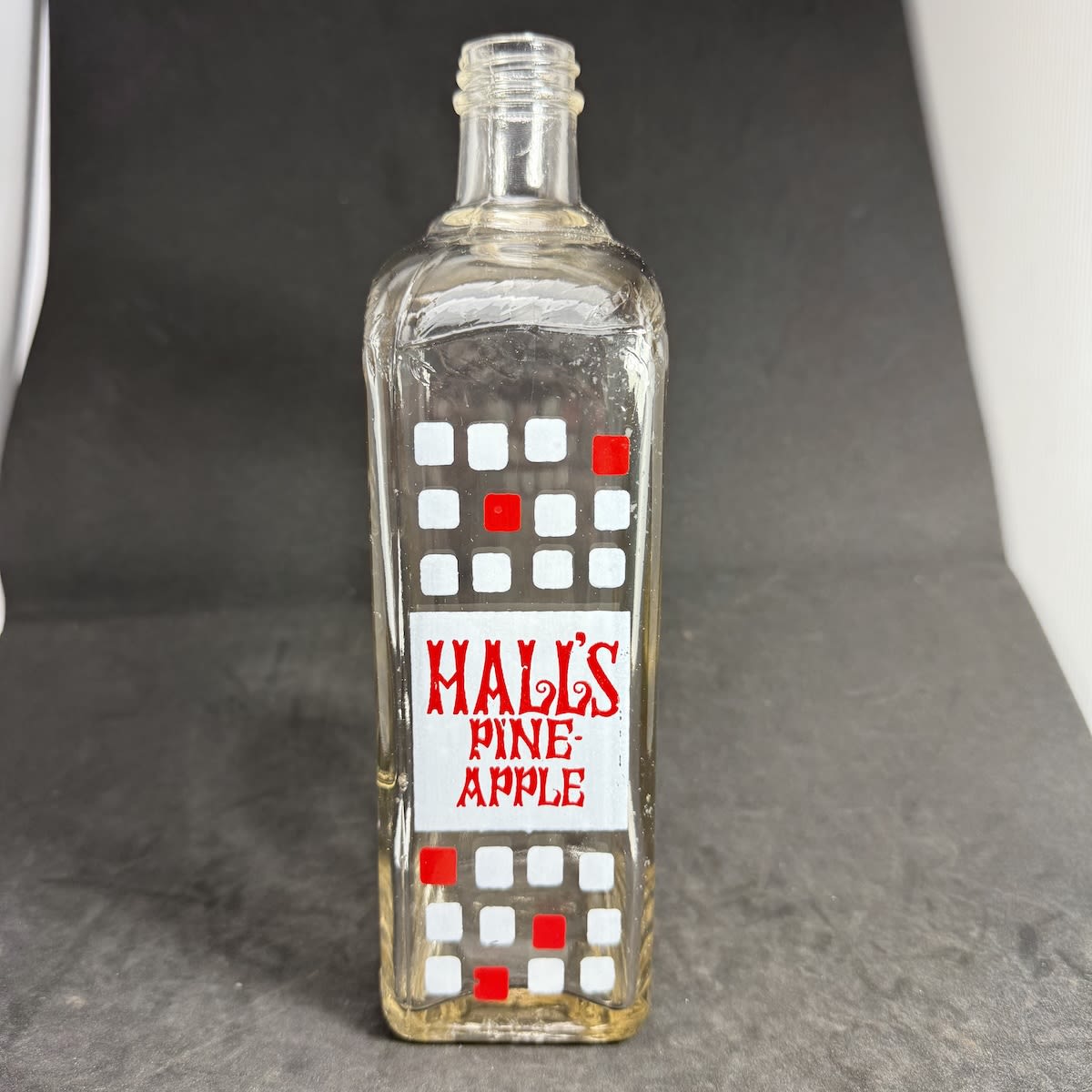 Cordial. Hall's Pineapple. Embossed and Ceramic Label. Geo. Hall & Sons Ltd Norwood. Clear. 26 oz (South Australia)