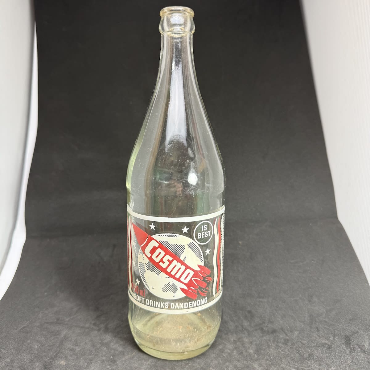 Ceramic Label Crown Seal. Cosmo Soft Drinks Dandenong. Rocket and Planet Earth. Red & White Print. 750 ml size. (Victoria)