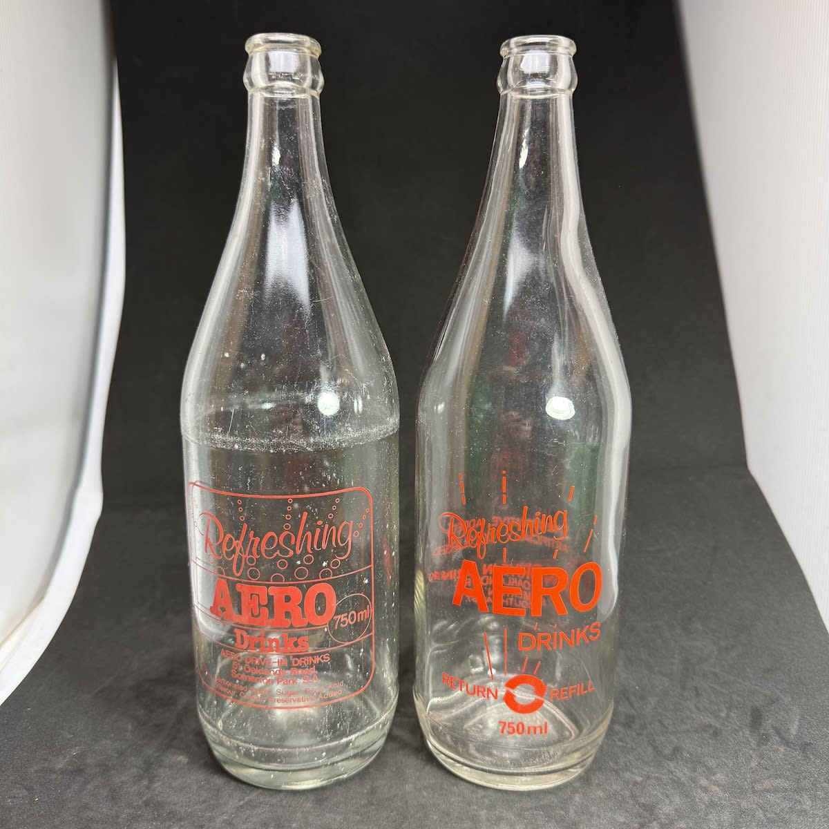 2 Ceramic Label Crown Seals. 2 variations of Aero Drive-In Drinks, Somerton Park, SA. 750 ml. Red/Orange prints. (South Australia)