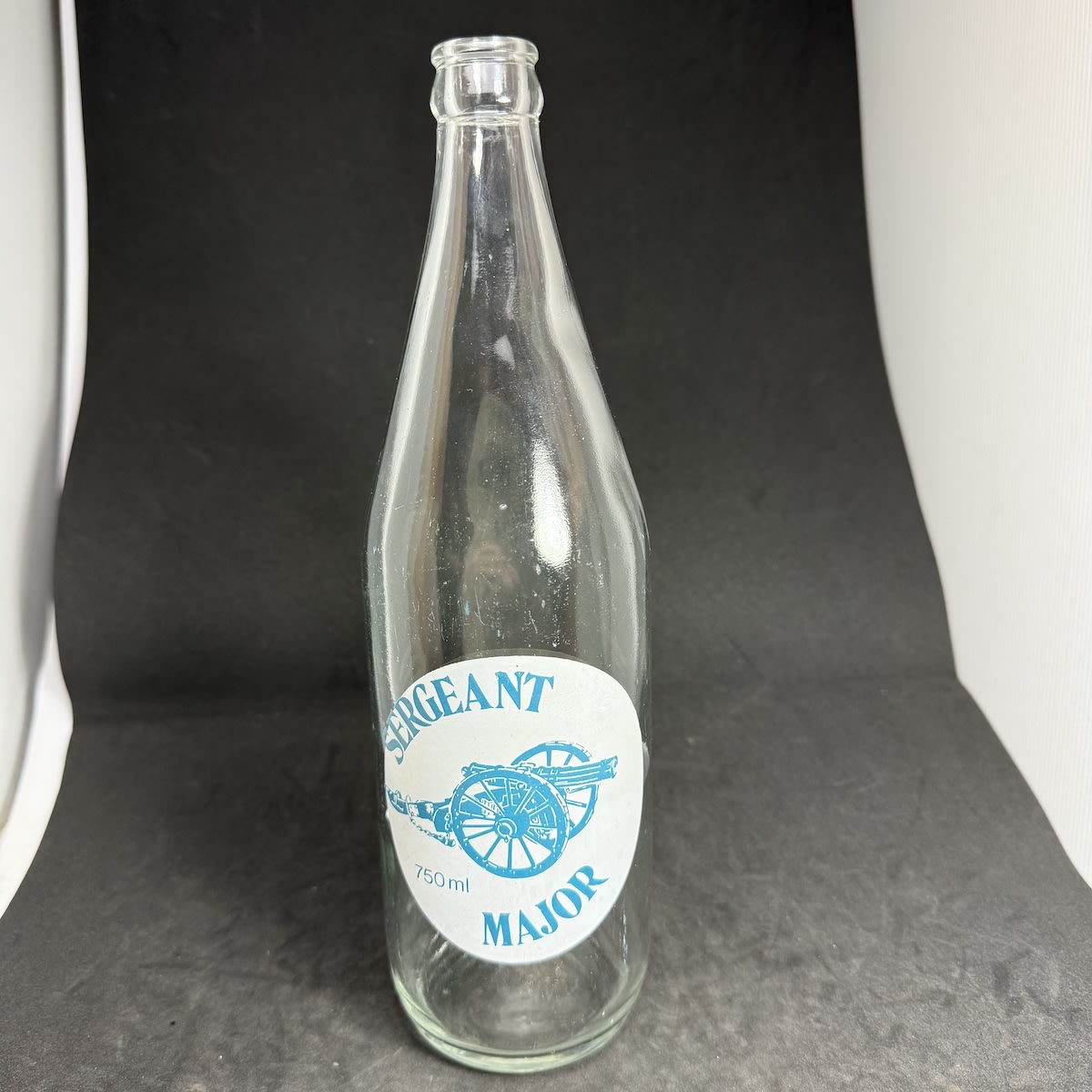 Crown Seal Ceramic Label. Sergeant Major, Mason & Mason, Oakey. 750 ml. Aqua & White print. Slightly offset print error. (Queensland)