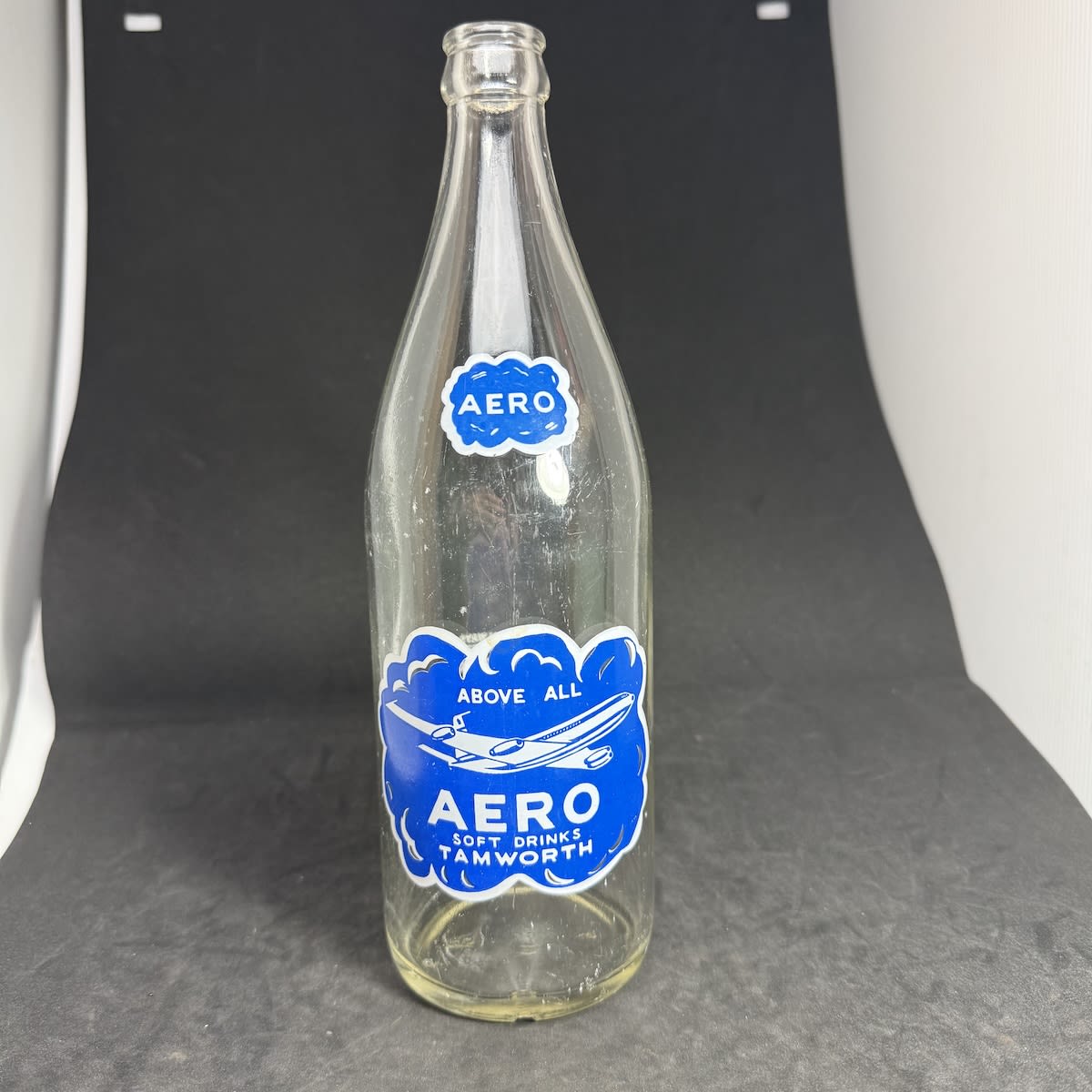 Ceramic Label Crown Seal. Aero Soft Drinks Tamworth. Jet Plane. Blue & White. 24 oz. (New South Wales)
