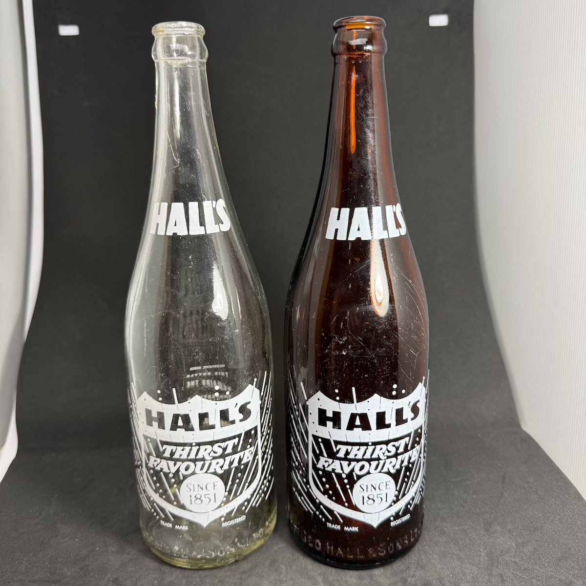 2 Ceramic Label Crown Seals: Both Hall's Thirst Favourite Since 1851. Geo. Hall & Sons Ltd Norwood. Clear & Amber. 26 oz. (South Australia)