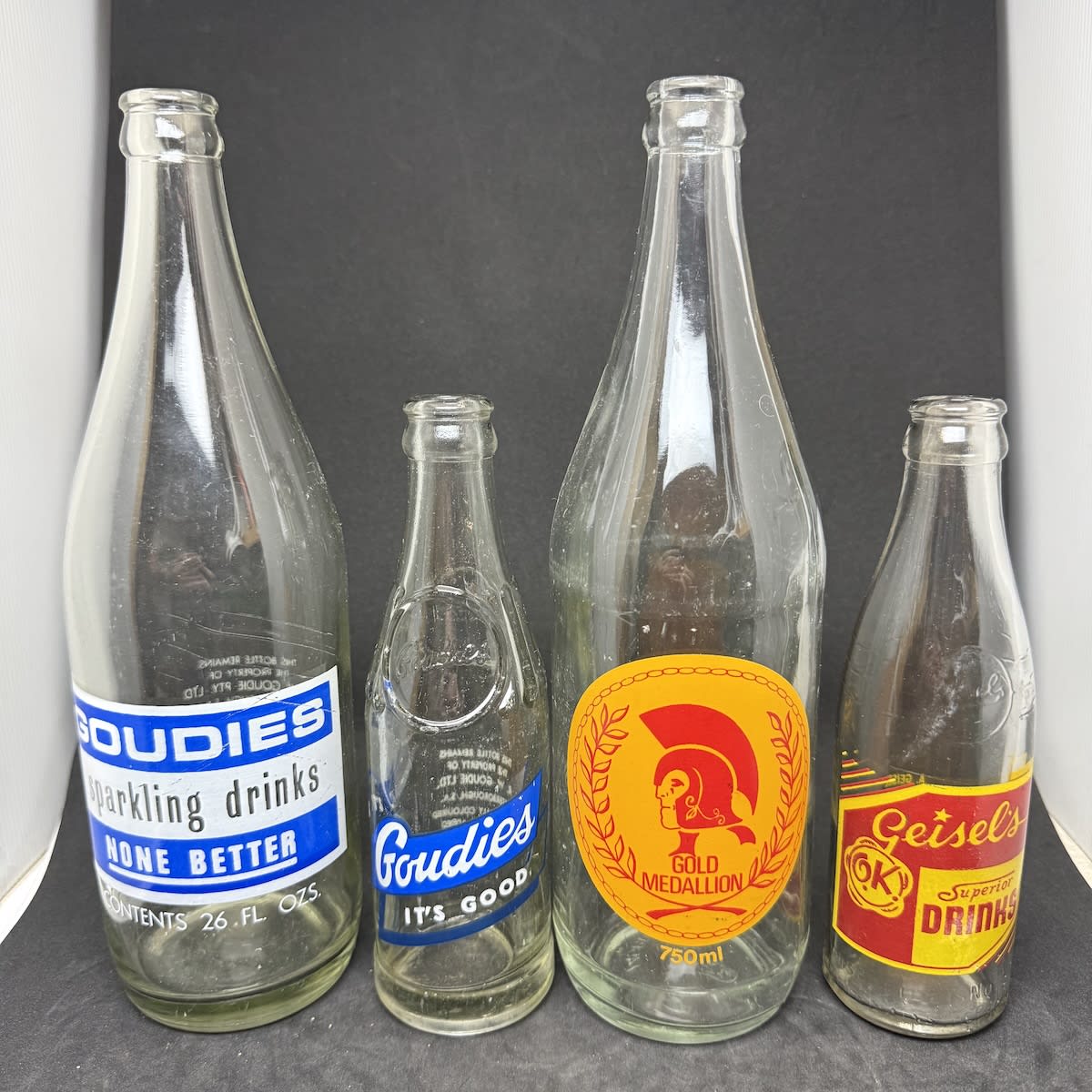 4 Ceramic Label Crown Seals: 2 x Goudies Peterborough, 26 & 7 oz Gold Medallion Drinks, Bowden A. Geisel, Murray Bridge. (South Australia)