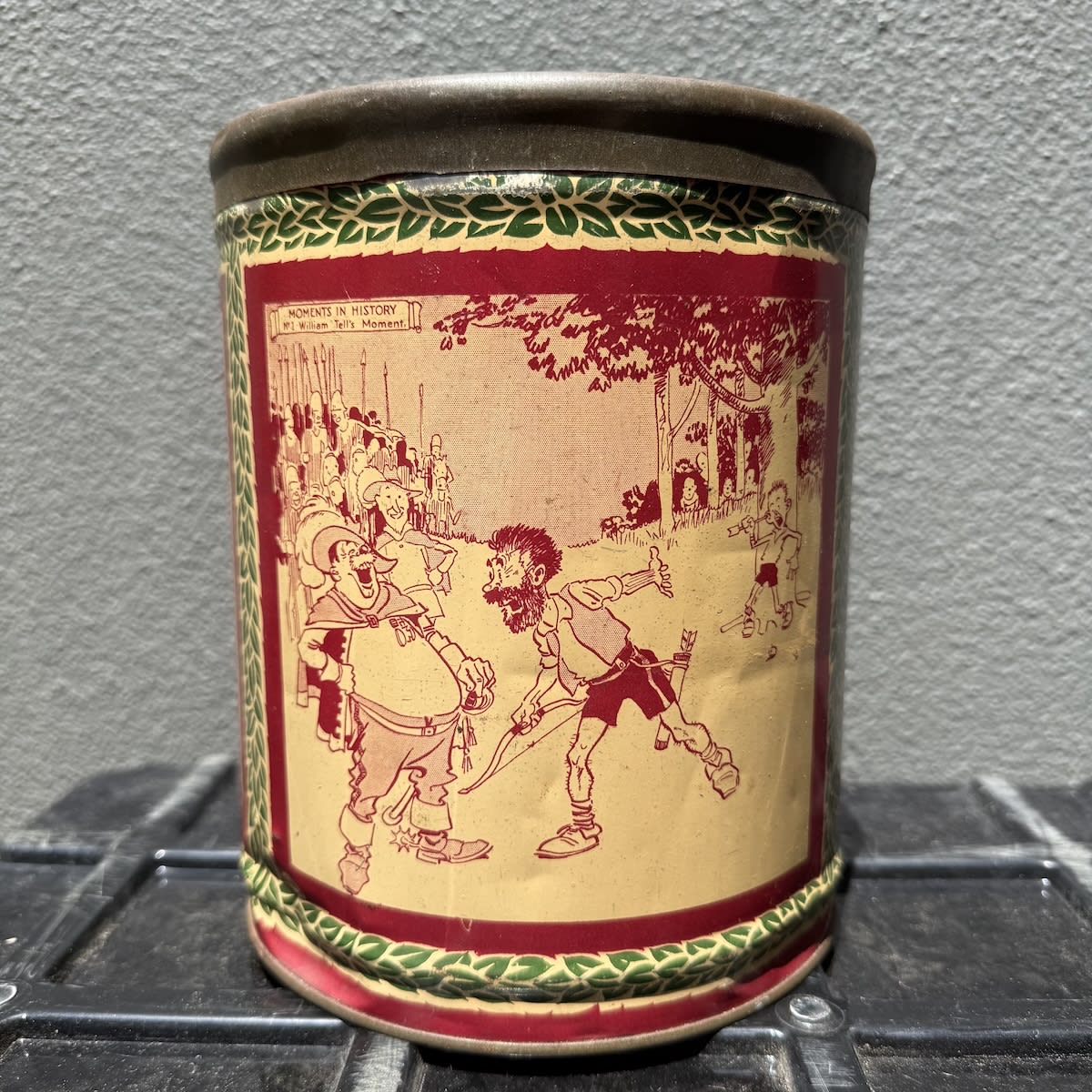 Lolly Tin. Minties Moments in History Tin. Three cartoon moments printed: William Tell, Lady Godiva and George Washington.