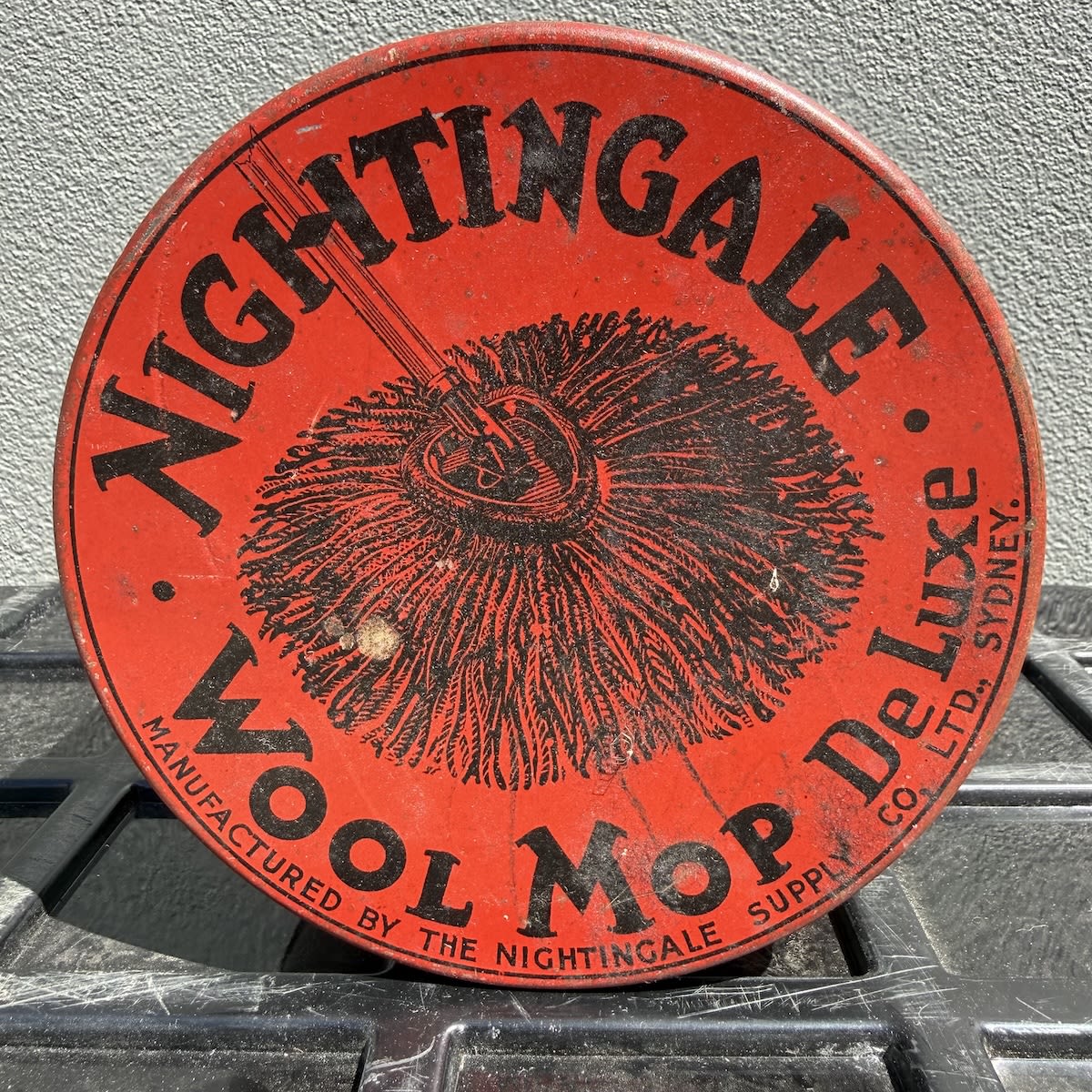 Tin. Nightingale Wool Mop Deluxe. Manufactured by the Nightingale Supply Co. Ltd., Sydney. Tin and lid (No mop inside!) (New South Wales)