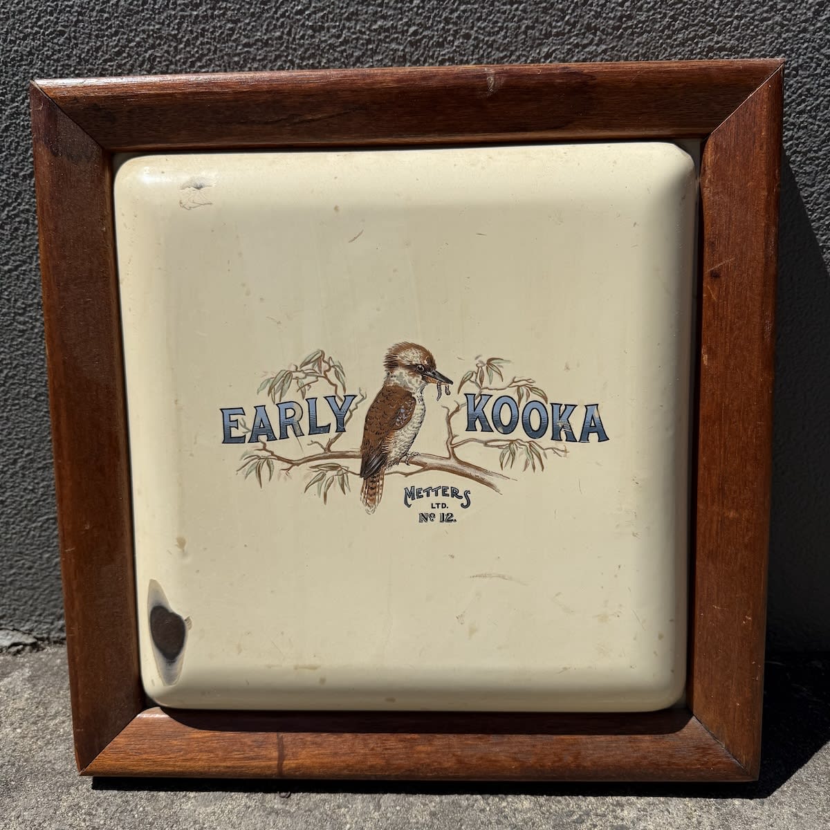 Enamel Stove Door. Early Kooka. Kookaburra with worm in beak. Metters Ltd. No. 12. Framed.