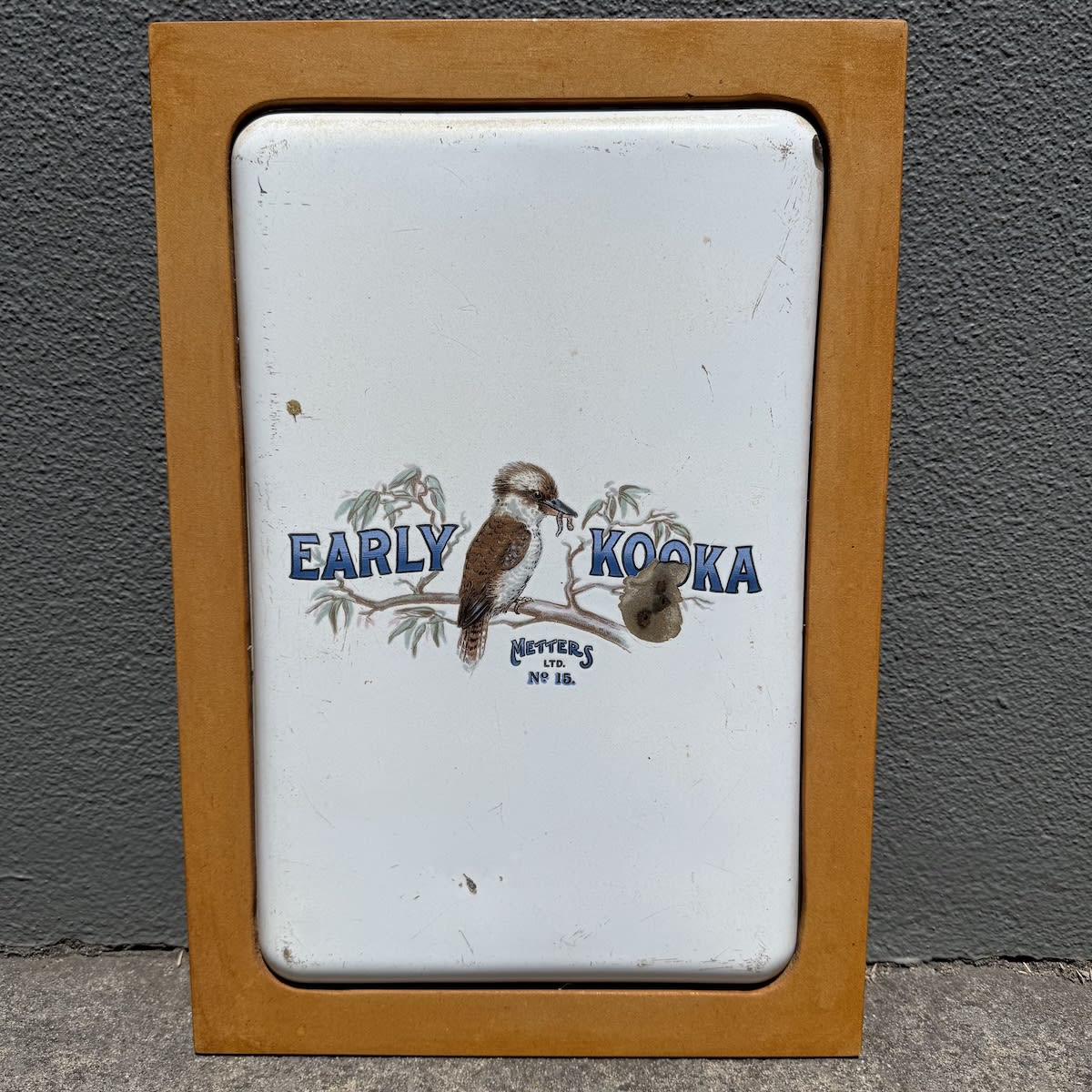 Enamel Stove Door. Early Kooka. Kookaburra with worm in beak. Metters Ltd. No. 15. Framed.