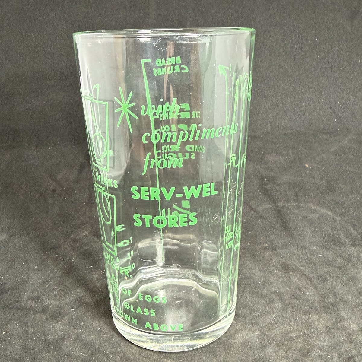 Ceramic Label Measuring Glass. With Compliments from Serv-Wel Stores. Egg Testing chart. Various product names and measurements. (South Australia)