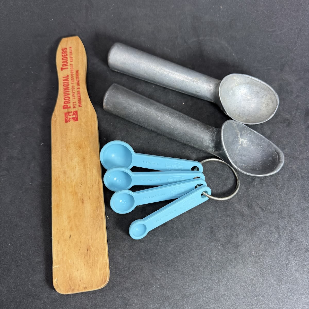 4 Items. 2 Ice Cream Scoops Wooden Pat, Provincial Traders Margarine & Shortening Set of rubber measuring scoops with Philadelphia Cheese branding.