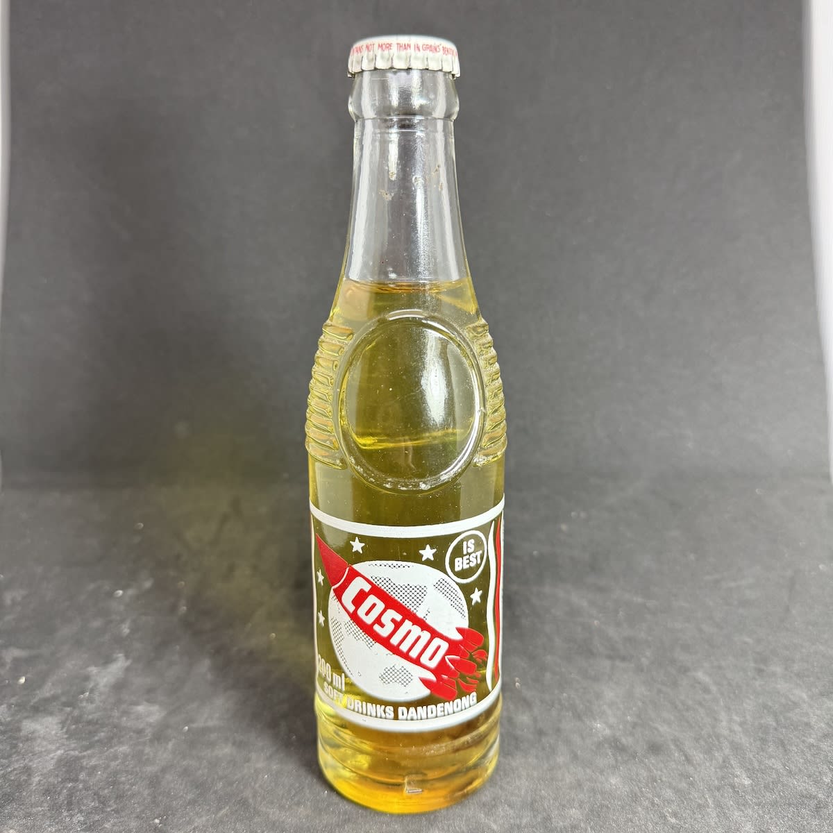 Ceramic Label Crown Seal. Cosmo is Best. Dandenong. Rocket & Planet. 7 oz Bullet shape. Original Cap and Contents. (Victoria)
