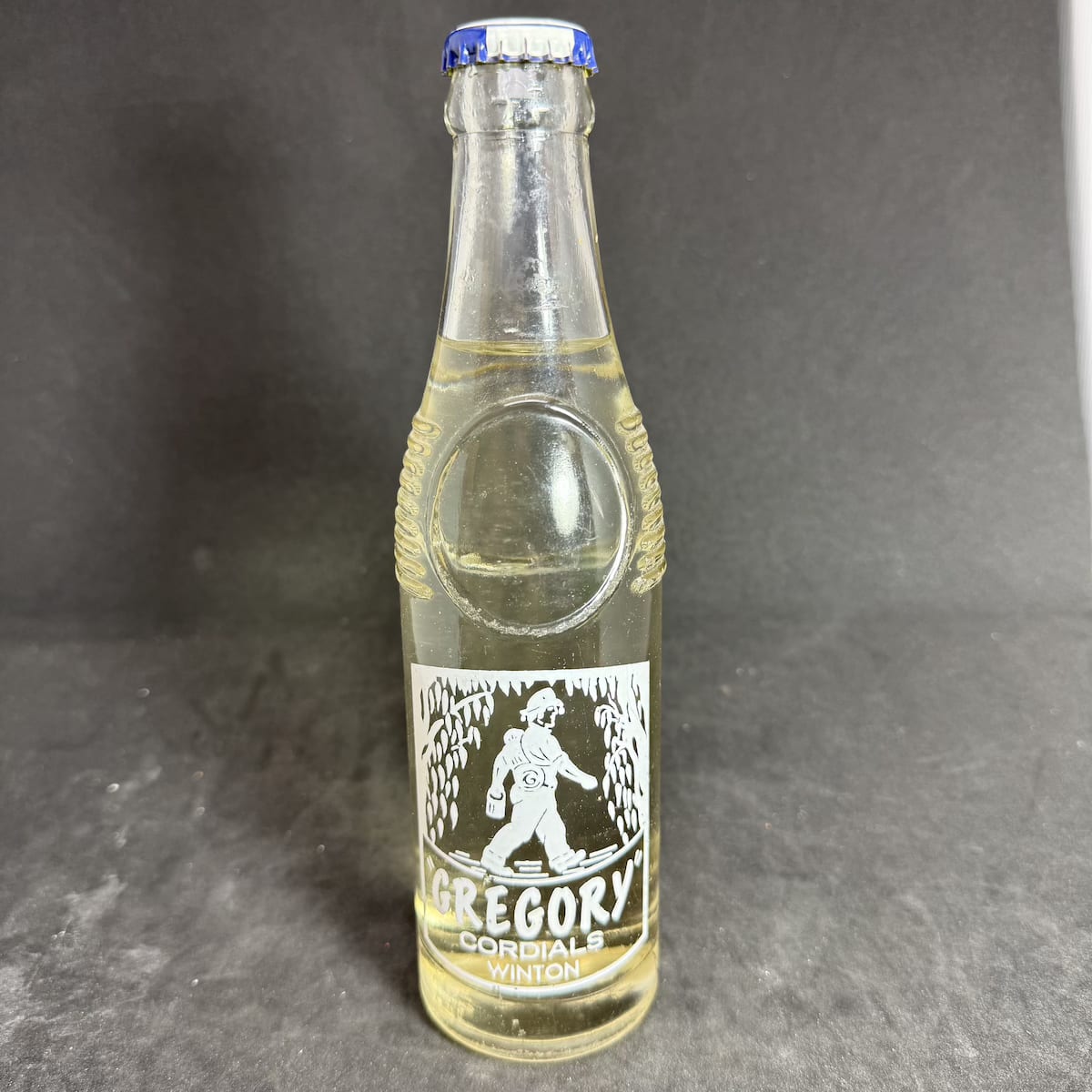 Ceramic Label Crown Seal. Gregory Cordials Winton. Swagman. Original cap and contents. Lemonade. "Bullet" shape. 7 oz. (Queensland)