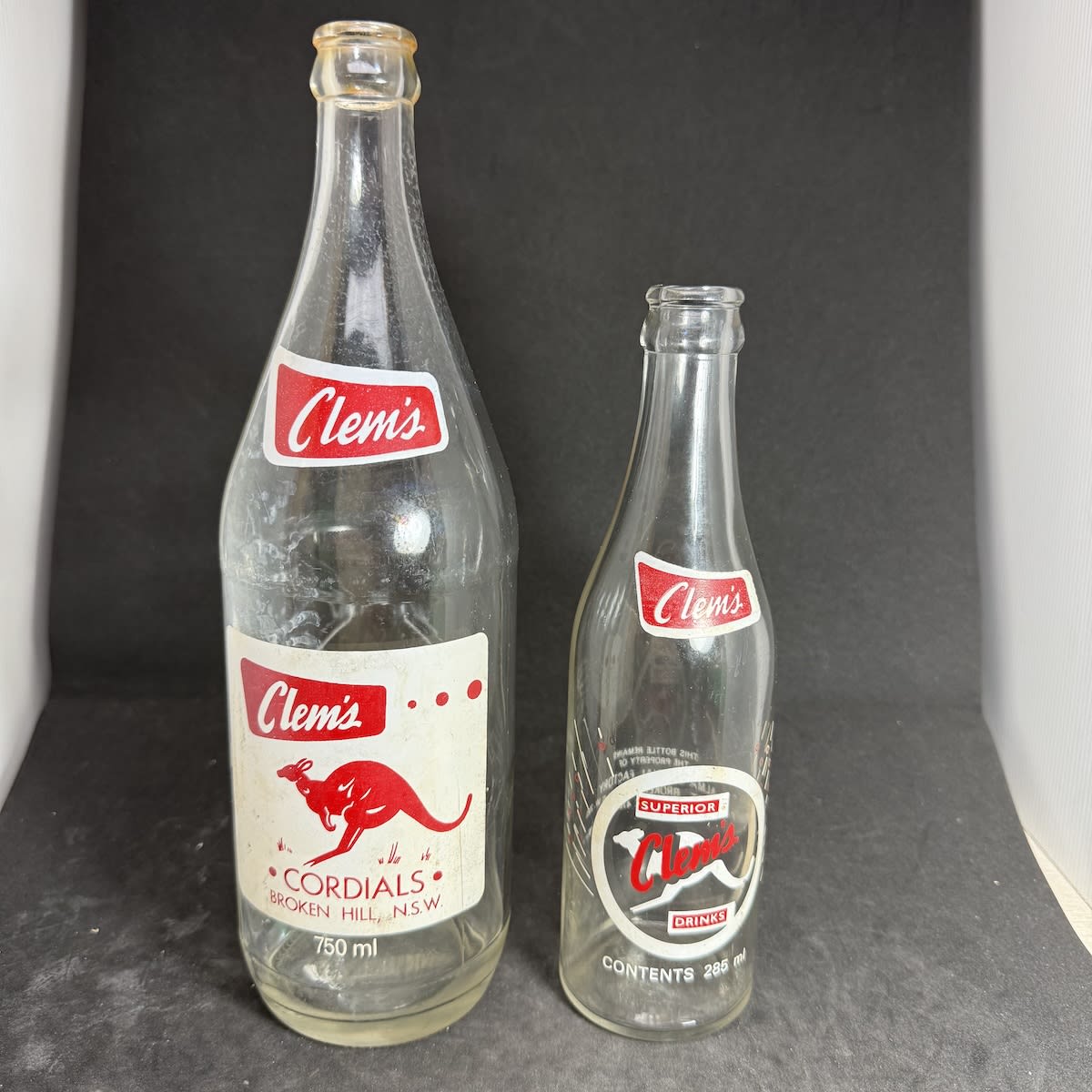 2 Ceramic Label Crown Seals. Both Clem's Cordials, Alma Cordial Factory, Broken Hill. 750 ml & 285 ml. Kangaroo. (New South Wales)