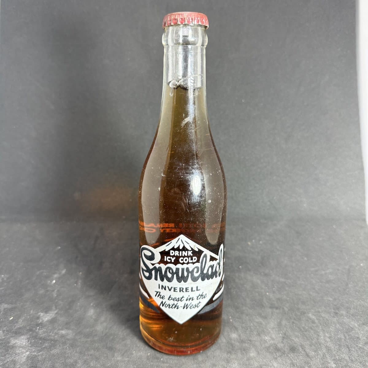 Ceramic Label Crown Seal. Snowclad Products Inverell. 10 oz. Mountain. Snowclad Products Ginger Ale Cap and Contents. (New South Wales)