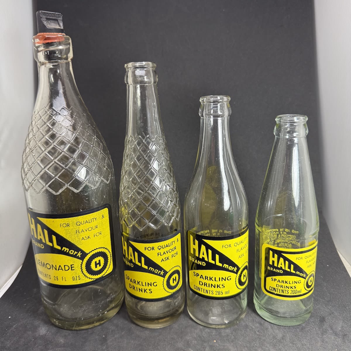 4 Ceramic Label Soft Drink Bottles. All Hallmark, H. W. Hall's Cordial & Ice Works Loxton. 26 oz Internal Thread, Tall patterned crown seal, 285 ml & 200 ml. (South Australia)