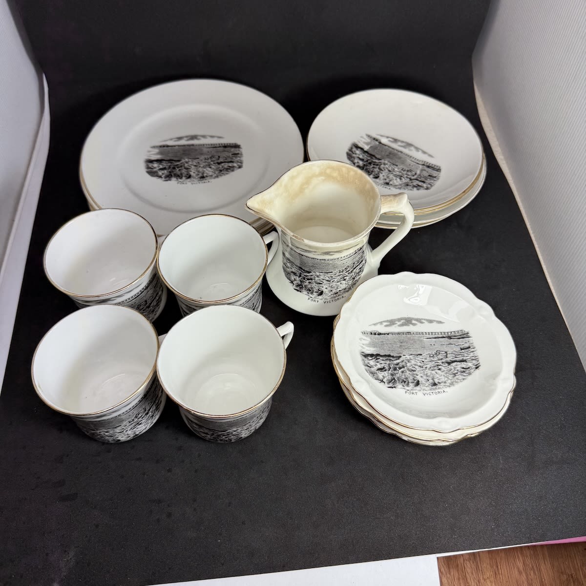 18 Pieces of Souvenirware for Port Victoria. Royal Stafford Bone China. 5 Plates, 4 cups, 4 saucers, 4 small dishes, Milk Jug. (South Australia)