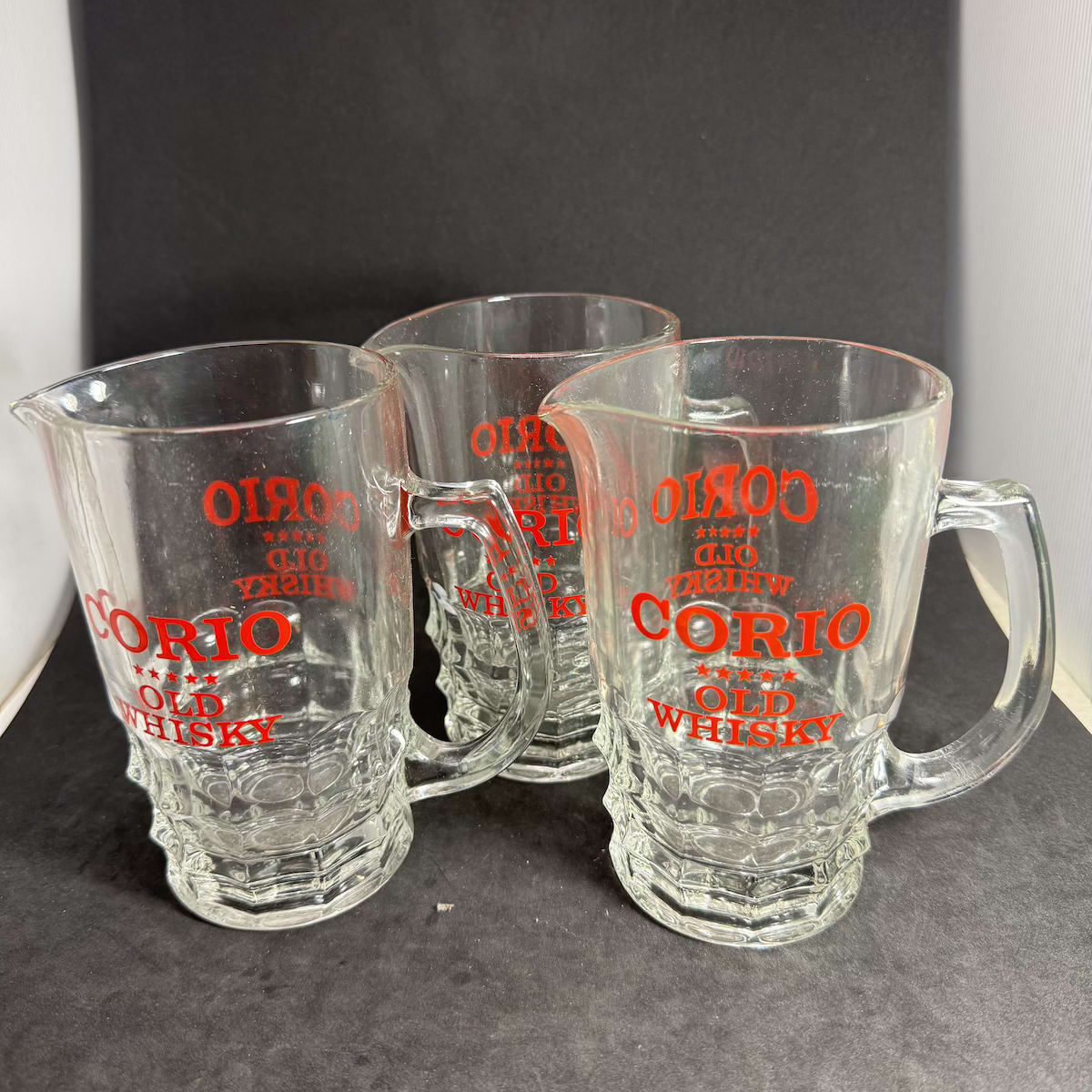 3 Whisky Water Jugs. All Corio Five Star Old Whisky. Fancy base glass jugs with red ceramic label print.
