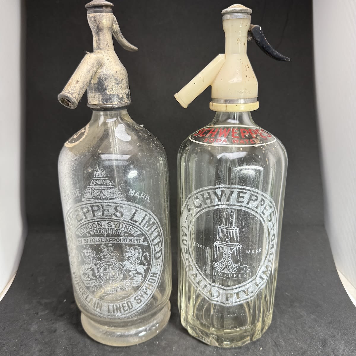 2 Schweppes Soda Syphons. Fluted and round. Coat of Arms, Fountain. Clear. 30 oz.