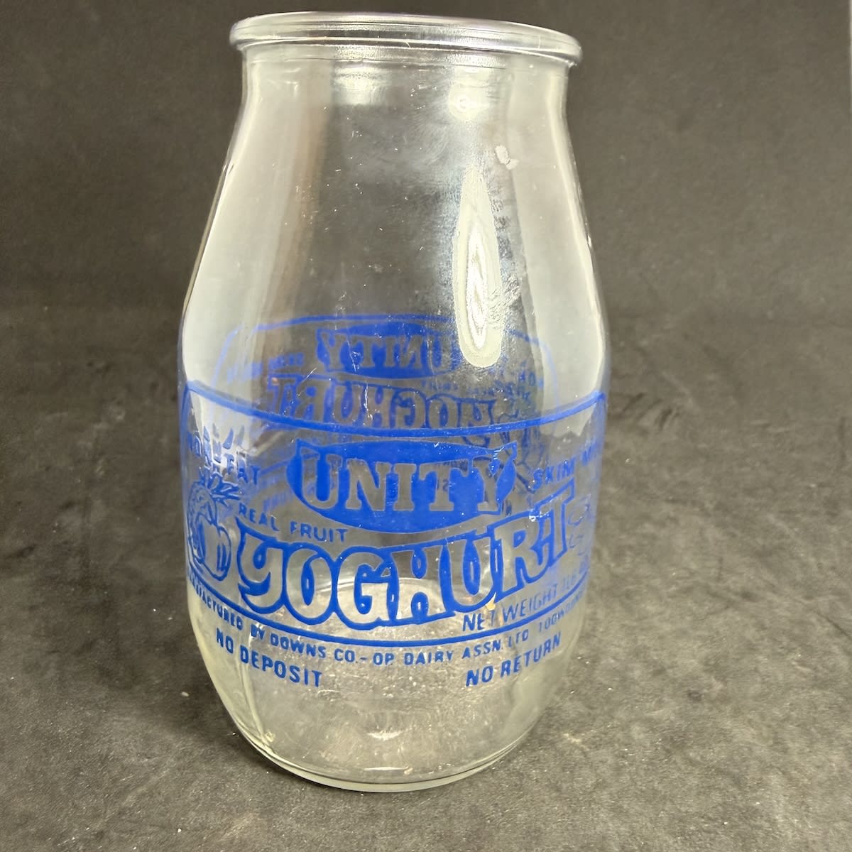 Ceramic Label Yoghurt. Unity Yoghurt, Downs Co-Op Dairy Assn Ltd, Toowoomba. Blue Print. 1 Lb 4 Oz. One Trippa type. No deposit, No return. (Queensland)