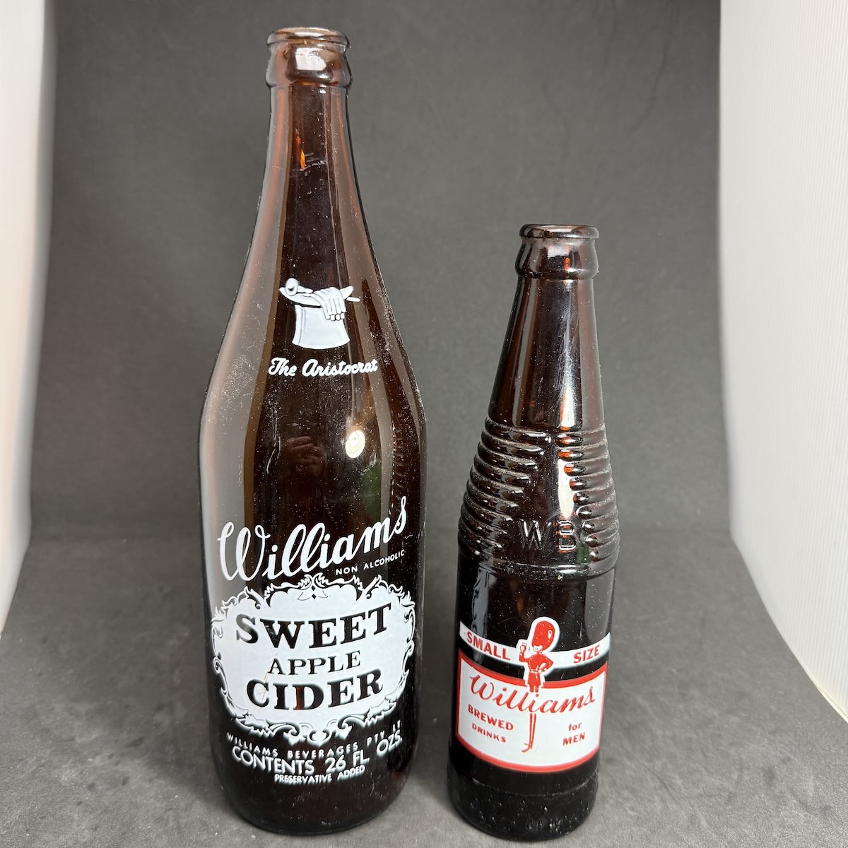 2 Amber Ceramic Label Bottles: Williams Sweet Apple Cider, The Aristocrat, Williams Beverages Mitcham, 26 oz Small size Williams Brewed Drinks for Men, Williams Beverages Mitcham. (South Australia)