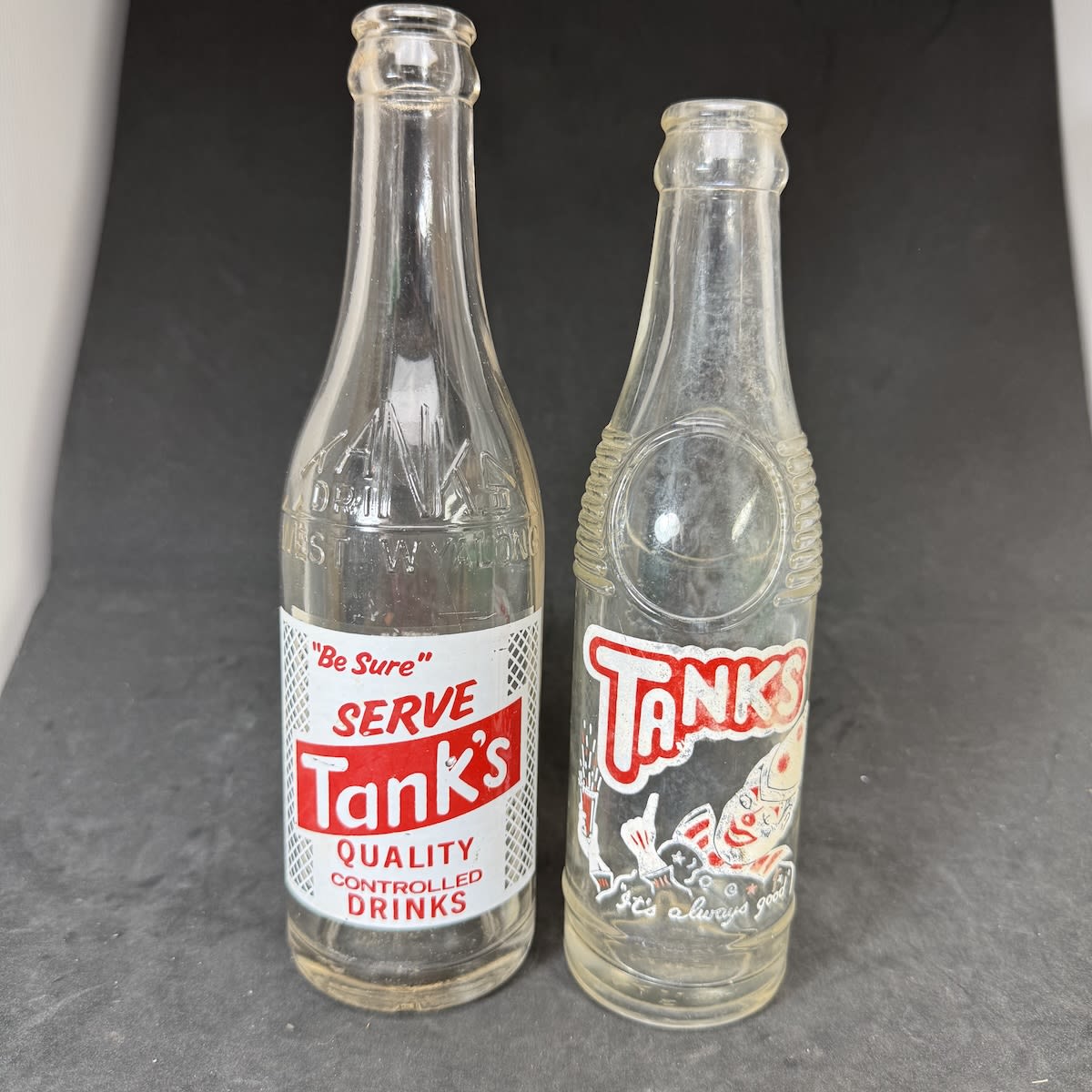 2 Ceramic Label Crown Seals from Tanks West Wyalong. 10 embossed & printed, A. P. Tankard, West Wyalong; 7 oz "Bullet" type with clown. (New South Wales)