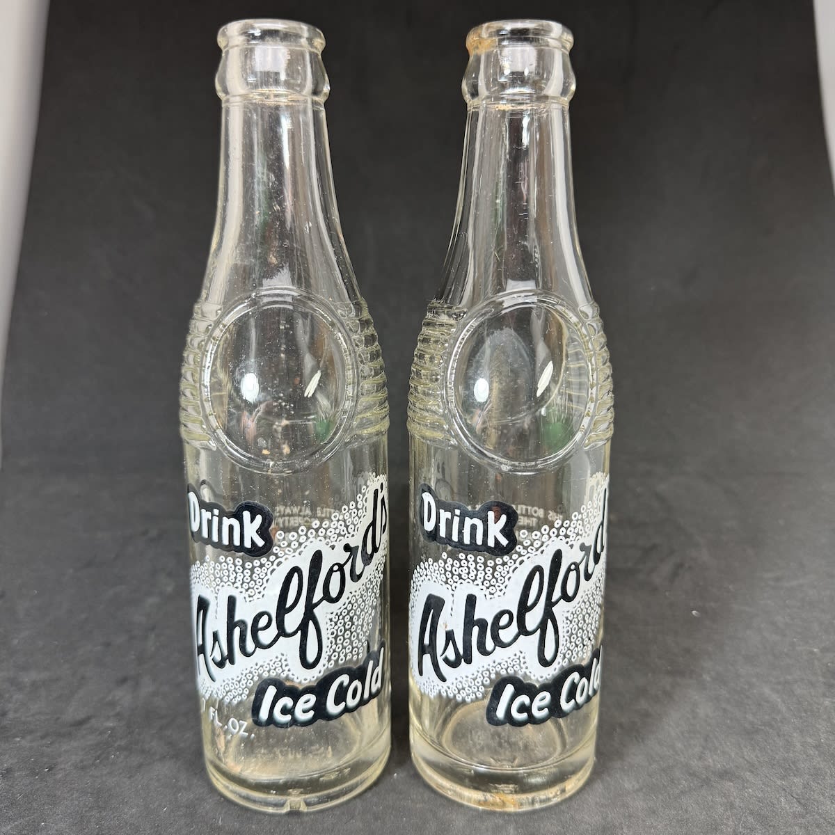 2 Ceramic Label Crown Seals. Bullet types both from N. & F. Ashelford Pty Ltd, Bathurst. one with 7 FL OZ printed and one without. (New South Wales)