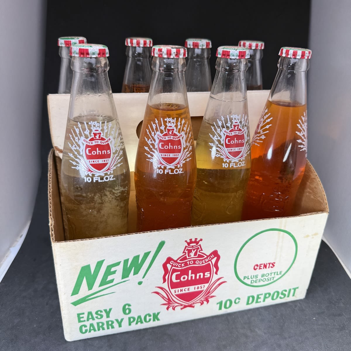 Ceramic Label Crown Seals & Cardboard Carry Pack. Cohns easy 6 Carry Pack. But with 8 x 10 oz bottles still sealed with 4 x Passionfruit and 4 x Cobbers Orange. Cohn Bros Ltd. (Victoria)