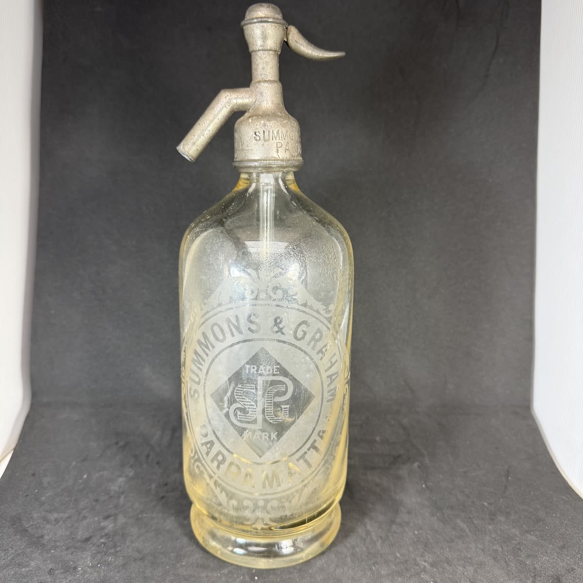Soda Syphon. Summons & Graham, Parramatta. Round with barley twist internal decoration. Clear. 30 oz. (New South Wales)