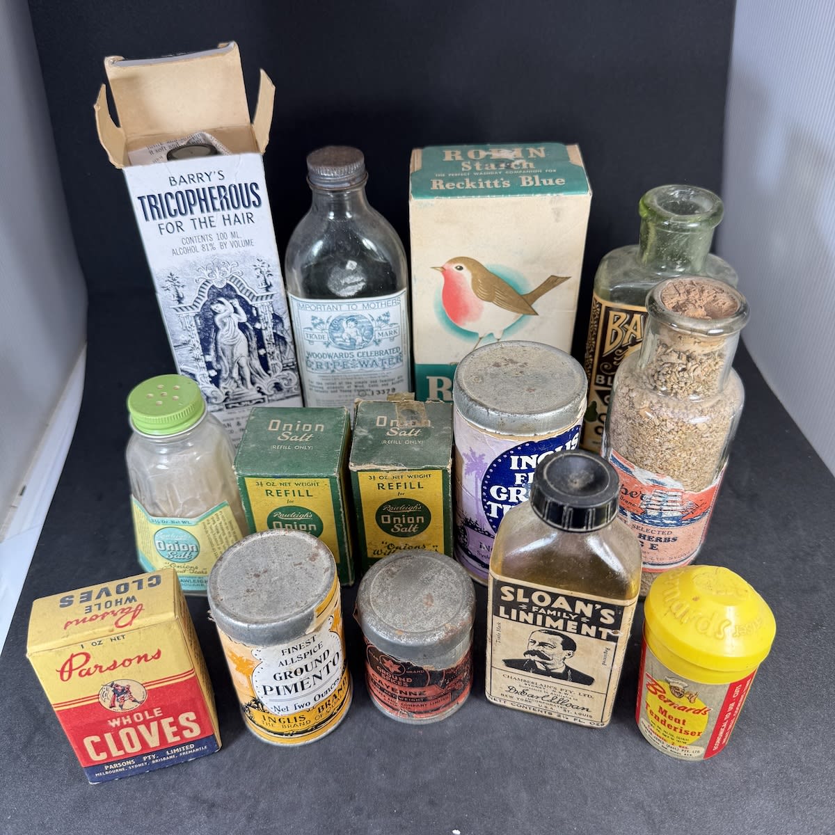 14 Labelled/Packaged Items: Tricopherous, Robin Starch; Woodwards Gripe Water; Balfes Hat Dyes; Rawleighs Onion Salt (& Refills); Clipper Dried Sage; Sloans Liniment; Bernards Meat Tenderiser; Inglis Turmeric; Harpers etc.