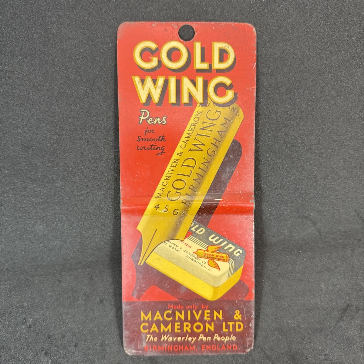 Small Printed tin advertising sign. Gold Wing Pens for Smooth Writing. MacNiven & Cameron Ltd, The Waverley Pen People, Birmingham, England.