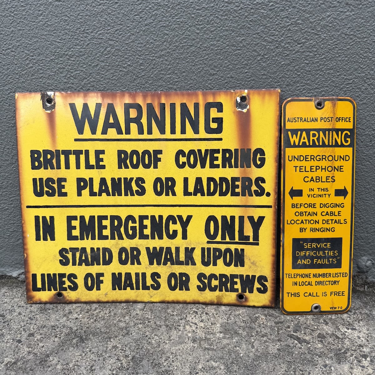 2 Warning Enamel Signs: Warning Brittle Roof Covering and Australian Post Office, Underground Cables.