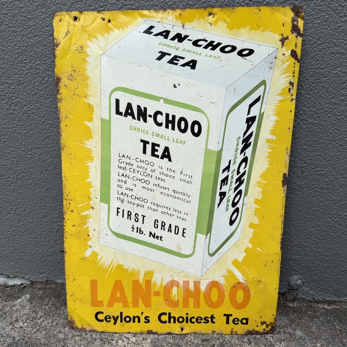 Tin Sign. Printed tin sign for Lan-Choo tea. Ceylon's Choicest Tea. Showing a Half Pound packet of Lan-choo tea.