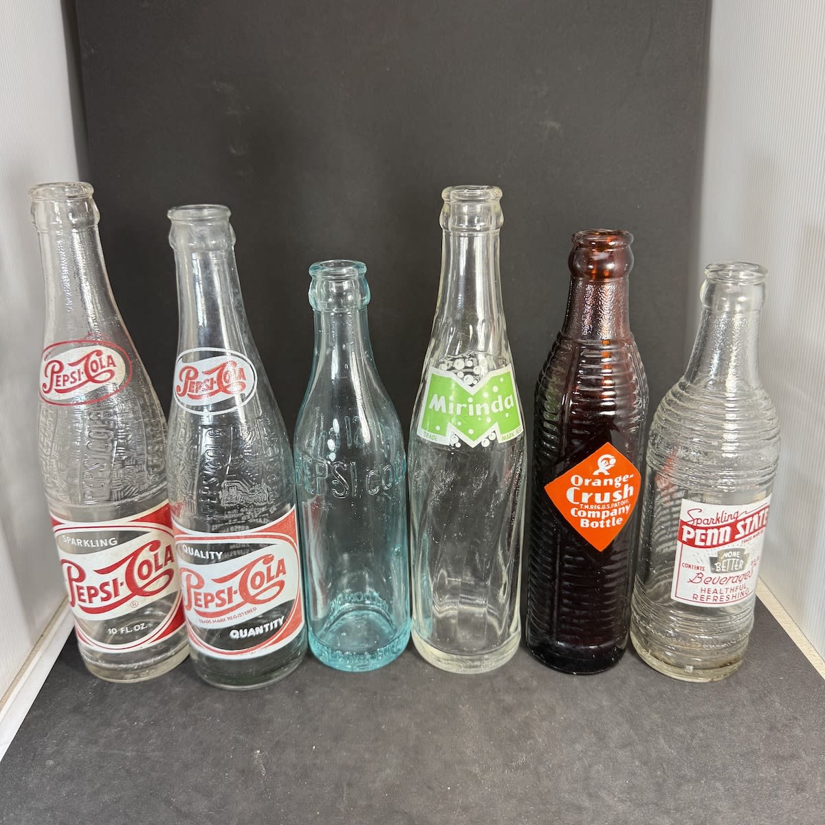 6 Crown Seal Soft Drinks: 2 x Different Pepsi-Cola red & white; Pepsi Cola embossed; Mirinda; Orange Crush, amber; Penn State Beverages.